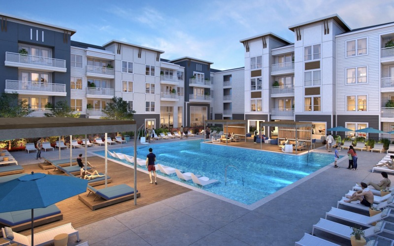 a swimming pool in a courtyard with people and lounge chairs
